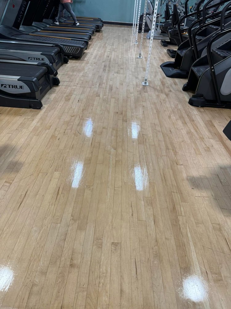 Gym floor gleaming after mopping