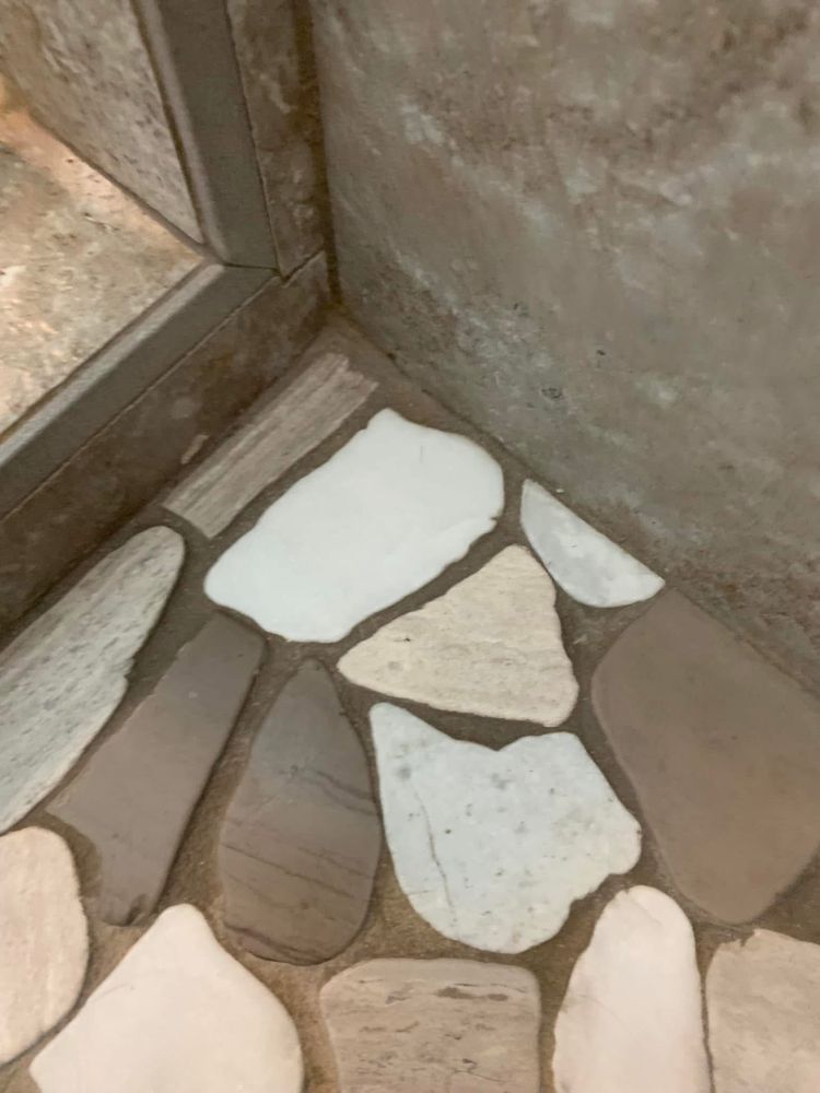 Stone shower corner clean after scrubbing