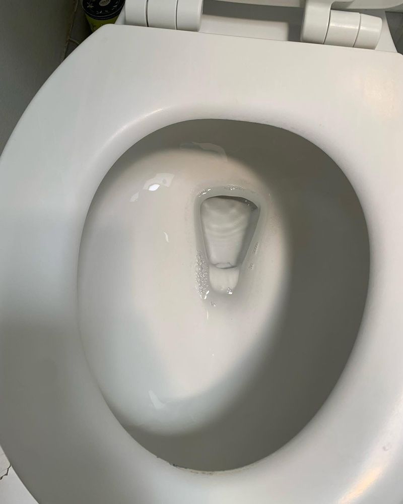 Toilet bowl restored to white after deep cleaning